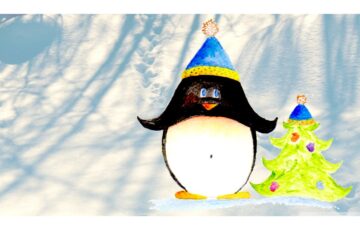 Sapkás pingvin a karácsonyfával